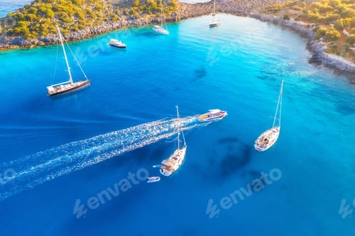 Preview: Aerial view of beautiful yachts and boats on the sea at sunset