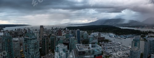 Preview: Aerial view of Downtown City during a stormy summer sunset