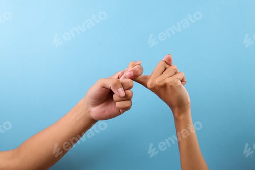 Preview: Fingers Interlocked In Hand Gesture Isolated On Blue Background