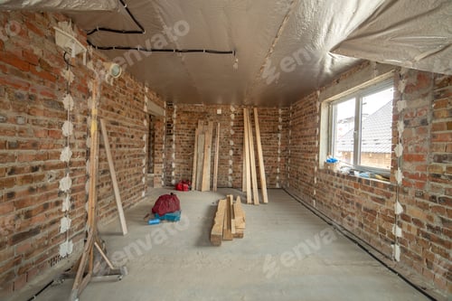 Preview: Unfinished Room with Insulation and Exposed Brick Walls