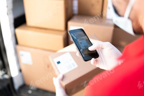 Preview: Male hands with gloves taking a picture of a shipping label