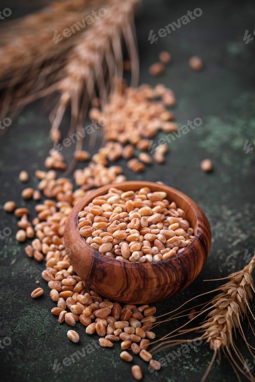 Preview: Wheat grains and spikelets on rusty background.