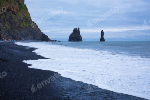 Preview: Iceland. View on the black coast line and wave. Beach and sea.