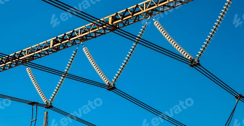 Preview: Low angle shot high voltage industrial-sized electrical power lines under the clear blue sky
