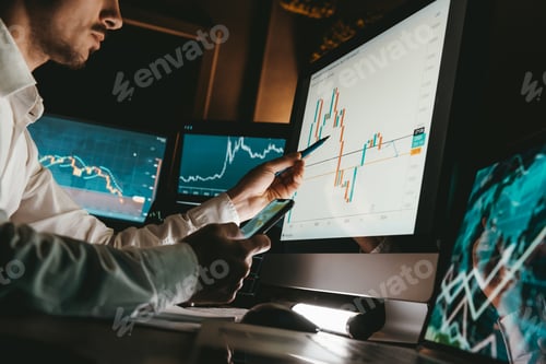 Preview: Close-up of male financial broker pointing computer monitor while analyzing stock market graph