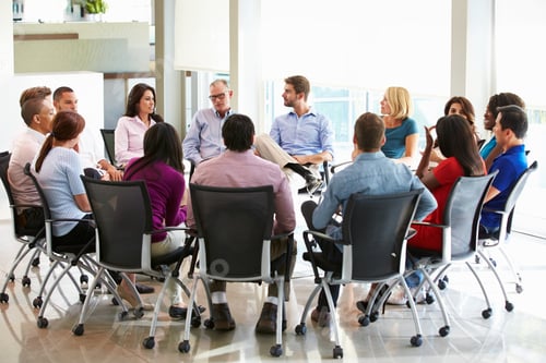 Preview: Multi-Cultural Office Staff Sitting Having Meeting Together