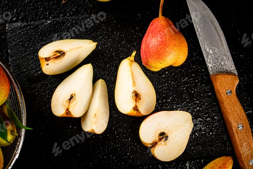 Preview: Sliced ripe pear with a knife.