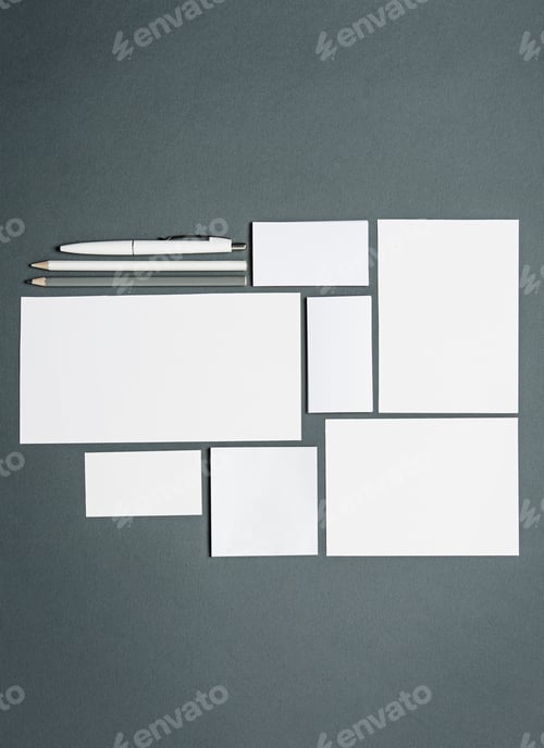 Preview: Mock-up business template with cards, papers, pen. Gray background.