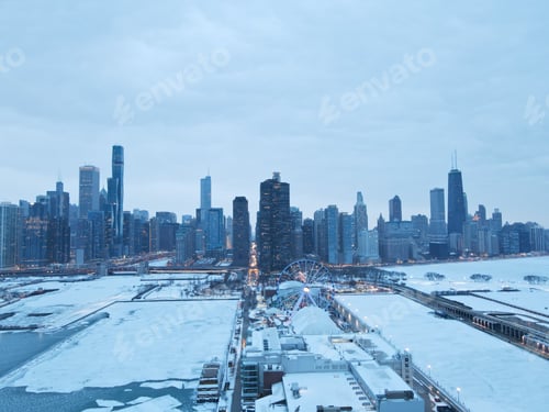 Preview: View of a city in winter, showcasing the snow-covered buildings and roads, Chicago