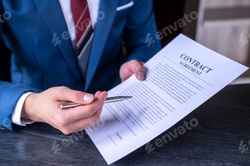 Preview: business man reading and signing a business contract, business agreement consensus signing, business