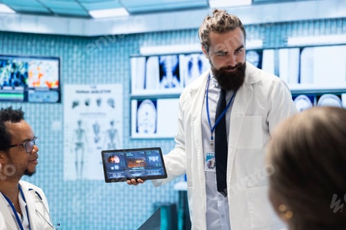 Preview: Neurology experts meeting to examine a mri brain scan in cabinet office