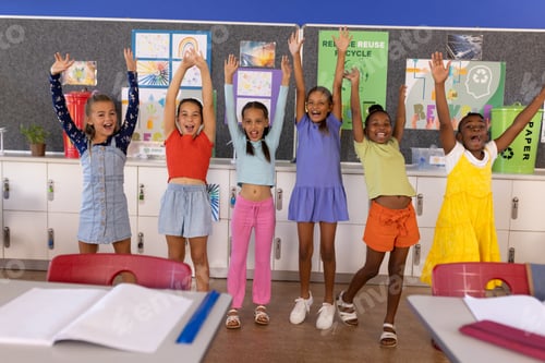 Preview: Portrait of happy diverse schoolgirls in elementary school classroom