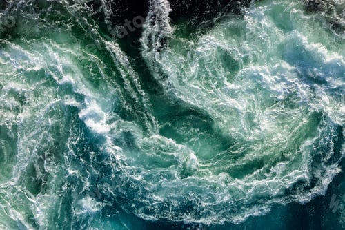 Preview: Blue waves of water of the river and the sea meet each other during high tide and low tide.