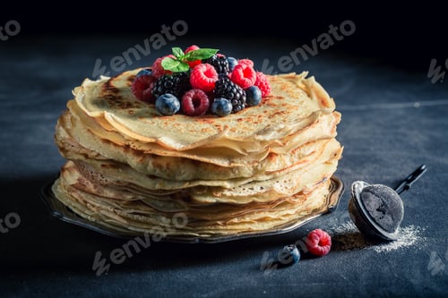 Preview: Tasty stack of pancakes with blueberries and raspberries