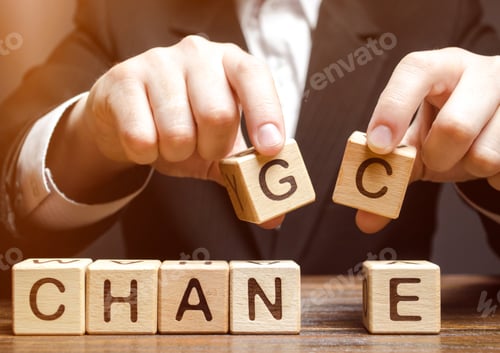 Preview: Businessman holding wooden blocks with the word Change to Chance