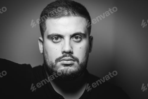Preview: Grayscale portrait of a young Caucasian male with a serious face