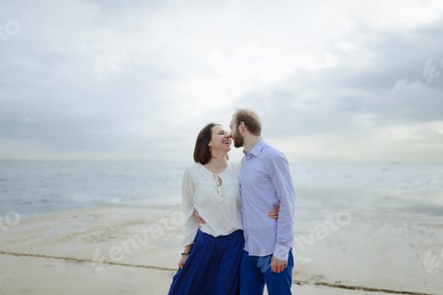 Preview: A loving couple, man and woman enjoying summer vacation on a tropical paradise beach.