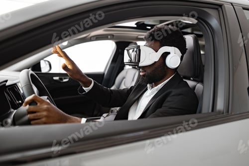 Preview: Businessman exploring new car interior using virtual reality headset