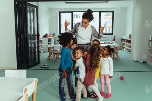 Preview: Enthusiastic Teacher With a Group of Young Children
