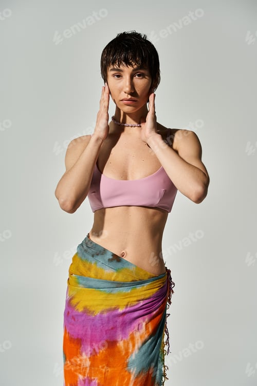 Preview: Vibrant Woman in Sarong Strikes a Pose