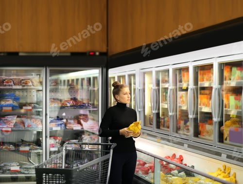 Preview: Woman Choosing Frozen Food From A Supermarket Freezer