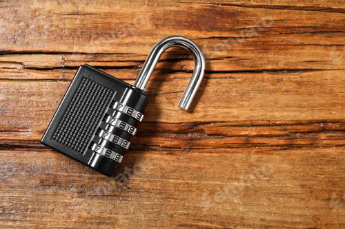 Preview: One steel combination padlock on wooden table, top view. Space for text