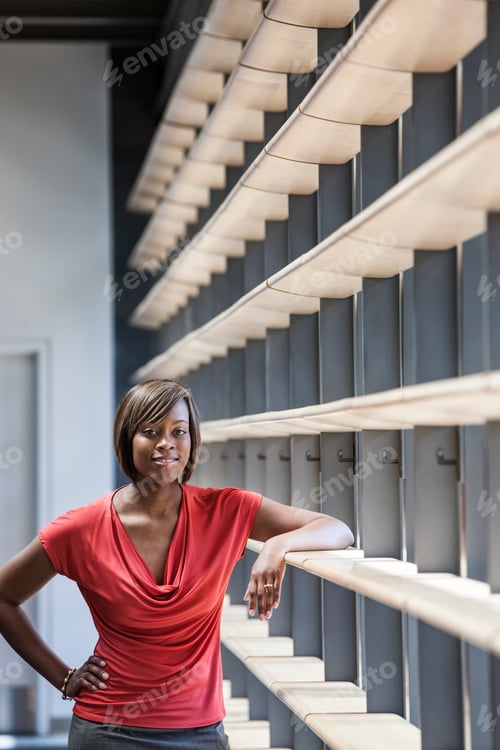 Preview: Black businesswoman in the lobby of a large office building.