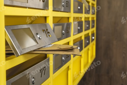 Preview: Metal mailboxes with keyholes, numbers and envelopes in post office, closeup