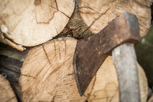 Preview: A deck of stacked logs and an axe