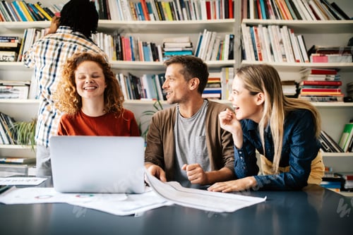 Preview: Group of successful business people designers architects in office