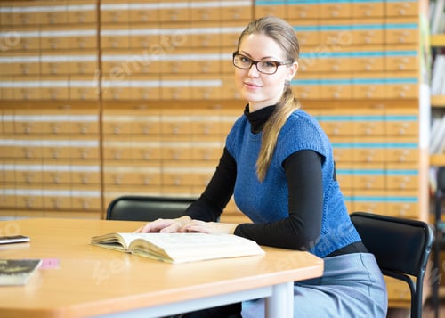Preview: Beautiful Girl Student Reading A Book In The Library
