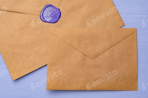 Preview: Letter envelope on lavender wooden background, copy space