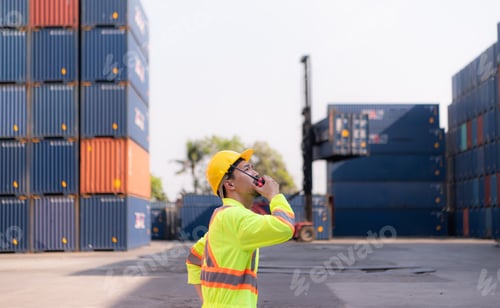 Preview: Workers in the import and export industry use walkie talkies to communicate with drivers