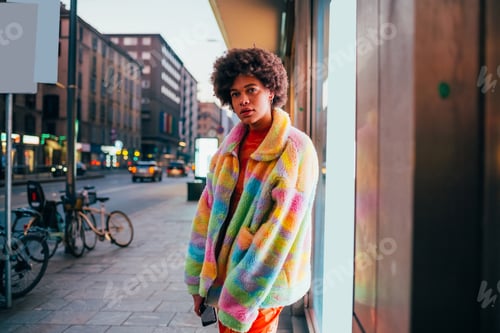Preview: Confident young black woman posing outdoor independent with determination and cool attitude