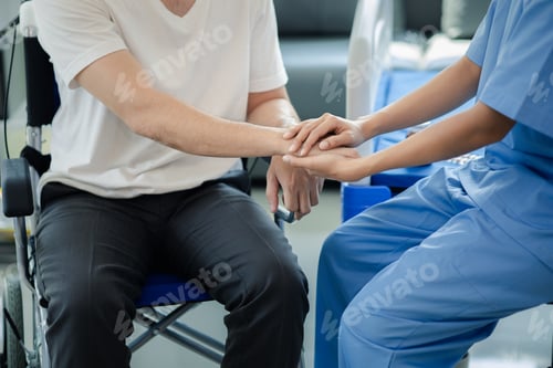 Preview: Male patient sitting in wheelchair undergoing a medical examination with specialist physician, treat