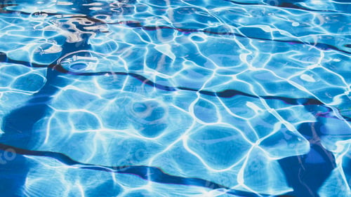 Preview: Ripple Water in swimming pool with sun reflection. Summer day at swimming pool.