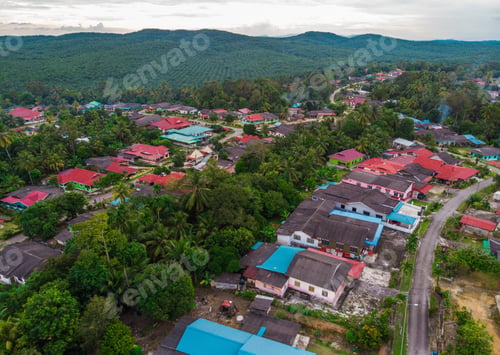 Preview: Aerial view of village houses and country road in Kota Tinggi, Johor, Malaysia.