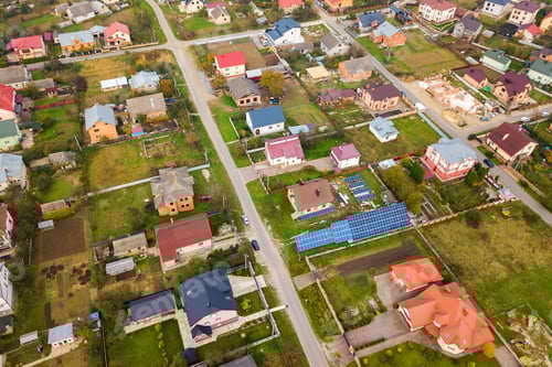 Preview: Aerial view of home roofs in residential rural neighborhood area