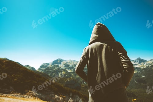 Preview: Unrecognizable female person standing at high muntain viewpoint