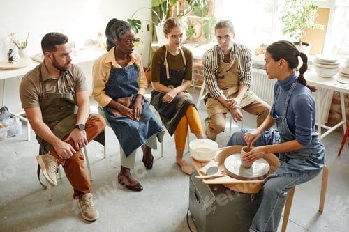 Preview: People Listening to Female Potter in Workshop