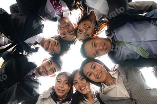 Preview: Business teamwork with their heads together