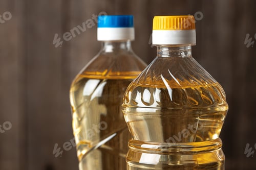 Preview: Olive oil bottle on wooden table, close up