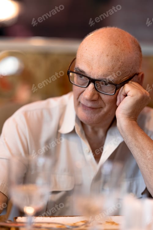 Preview: Thoughtful senior man in the restaurant