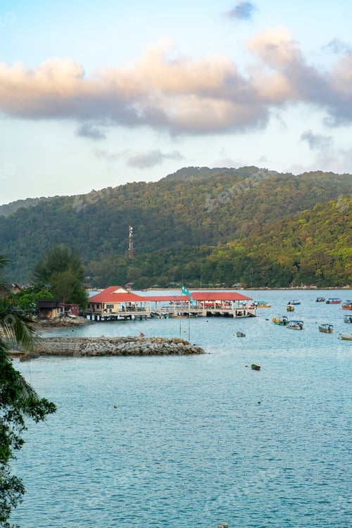 Preview: Perhentian Island jetty near the fisherman village during sunrise in Terengganu, Malaysia.