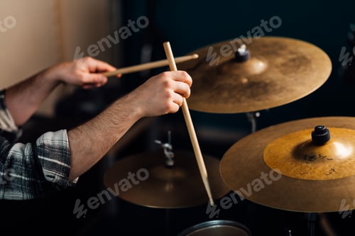 Preview: The drummer banging on the cymbals.