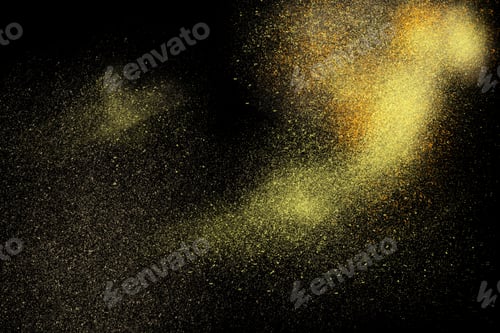 Preview: Freeze Motion Of Yellow Powder Exploding, Isolated On Black, Dark Background. Abstract Design Of