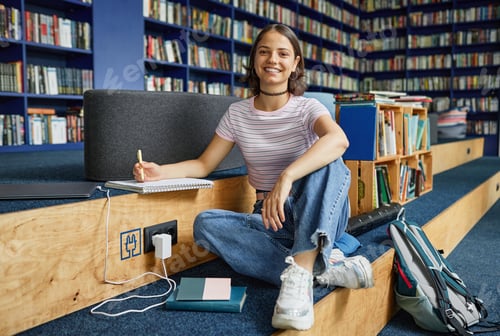 Preview: Smiling Teen Girl in Library