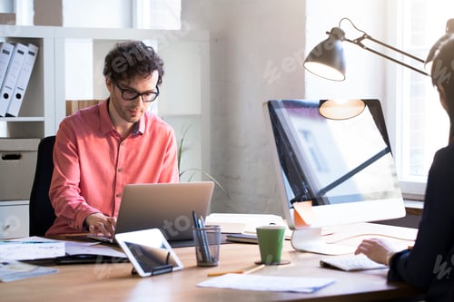 Preview: Man and woman working in office