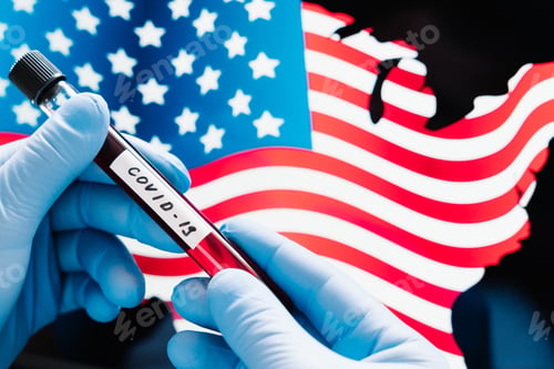 Preview: Hand in medical gloves holding sample blood in tube over flag of United States of America.