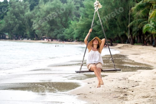 Preview: girl on the swing on the beach of Thailand